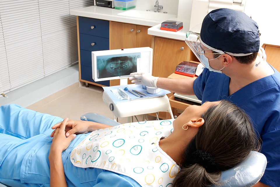 dentist showing a dental x-ray to his patient