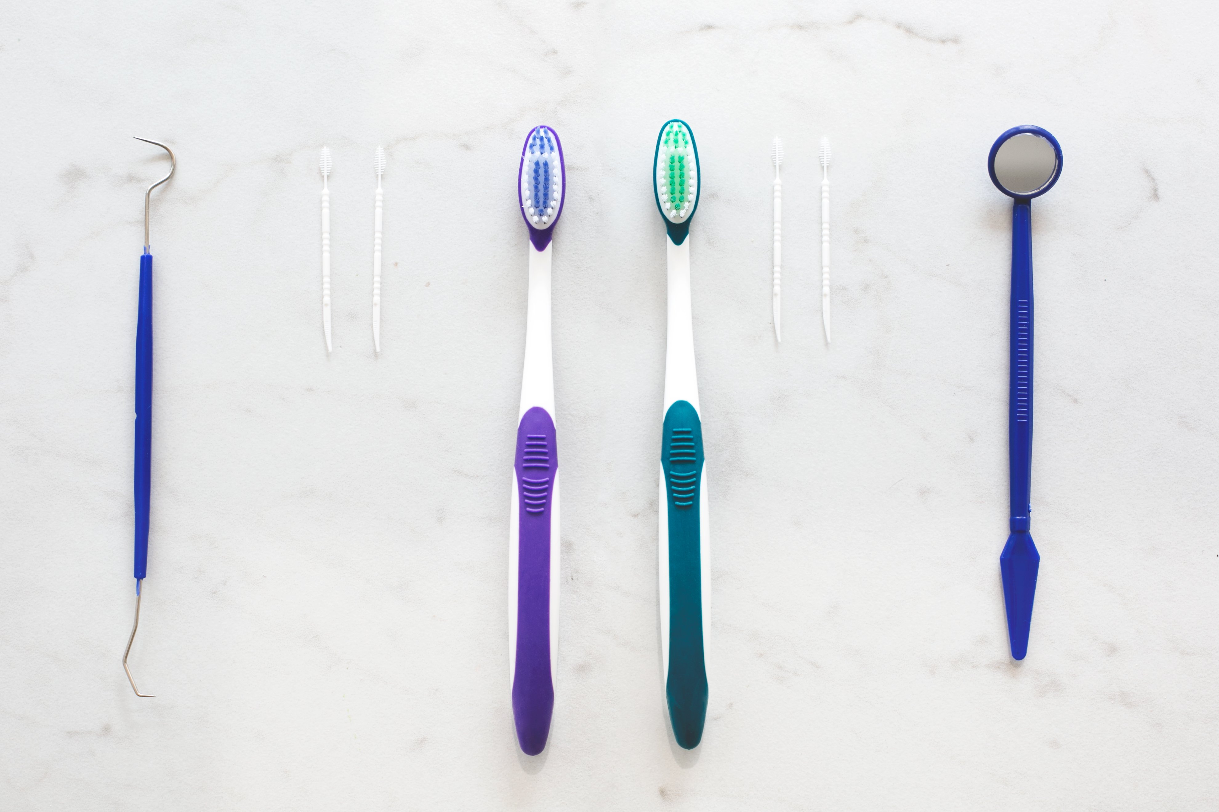 Dental care tools on marble countertop